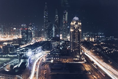 Nighttime cityscape of Mumbai featuring sparkling skyscrapers and vibrant life.