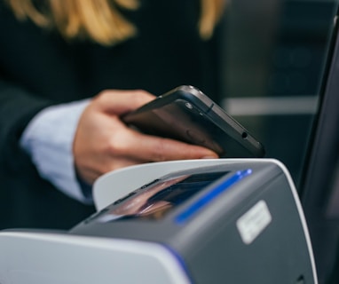 shallow focus photography of person holding smartphone