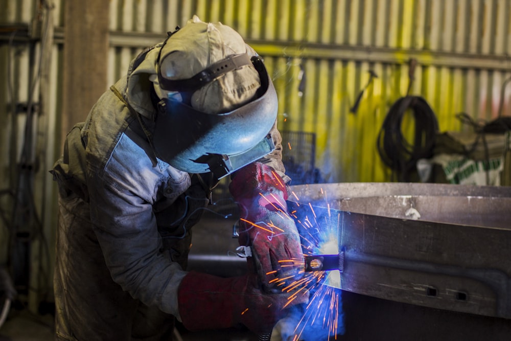 man soldering steel