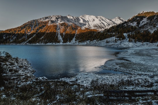 mountain near body of water in Neves-Stausee Italy