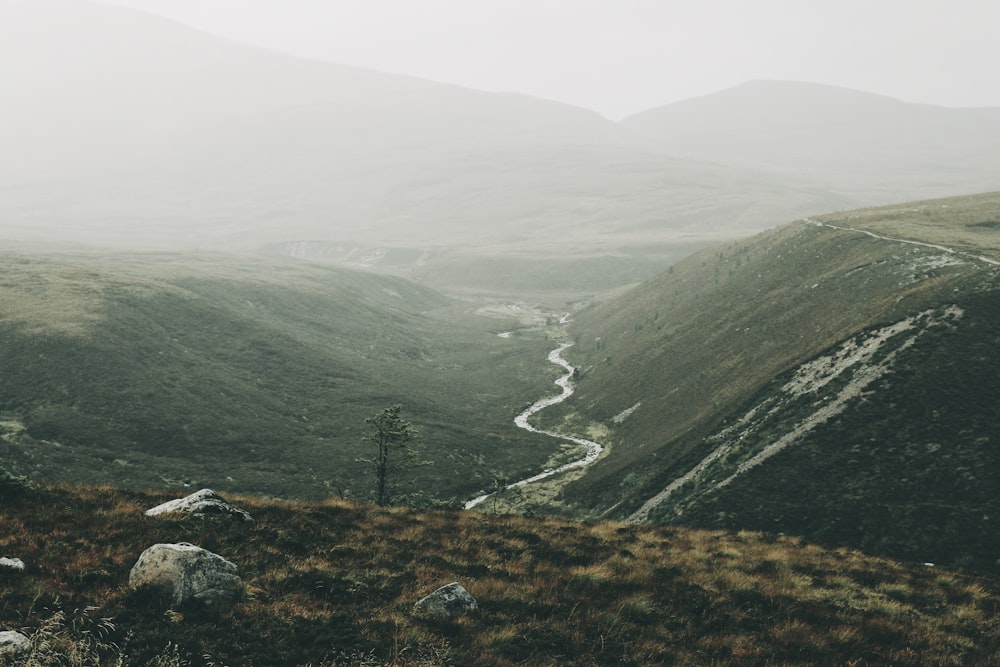 a view of a winding road in the mountains