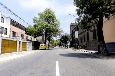 A peaceful street in Lille with a van parked, ready for a house clearance job.