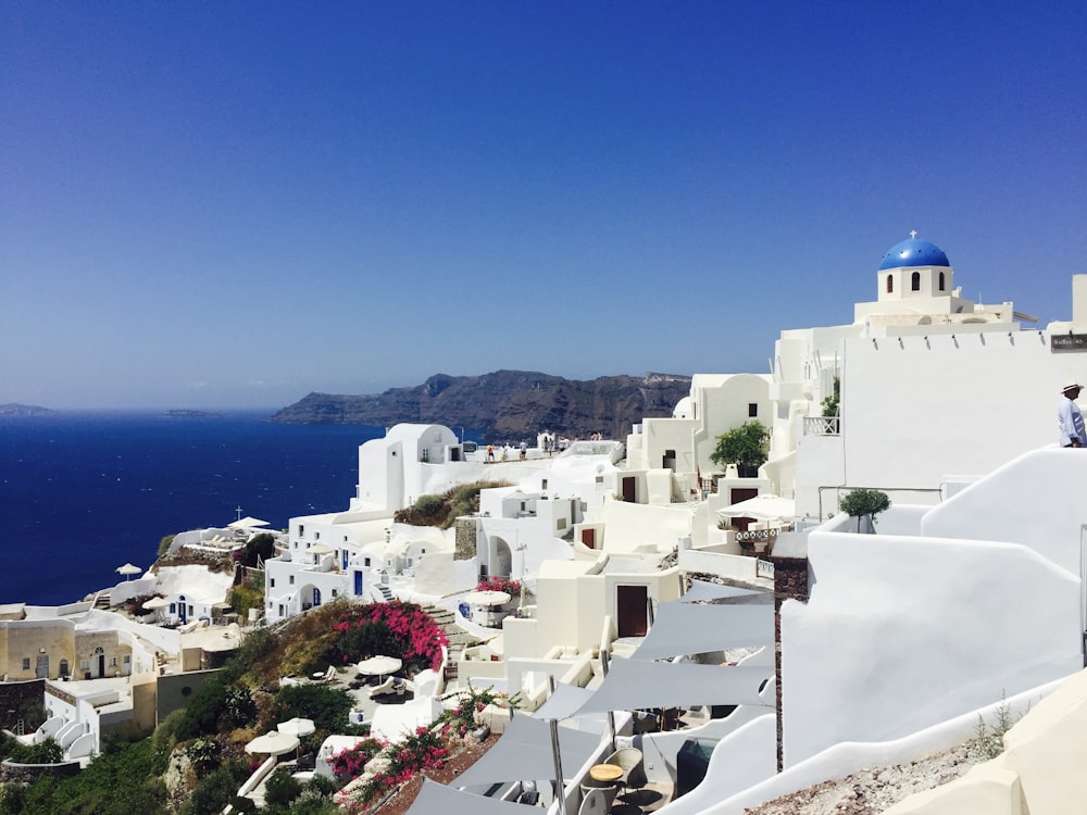 white concrete buildings under blue sky