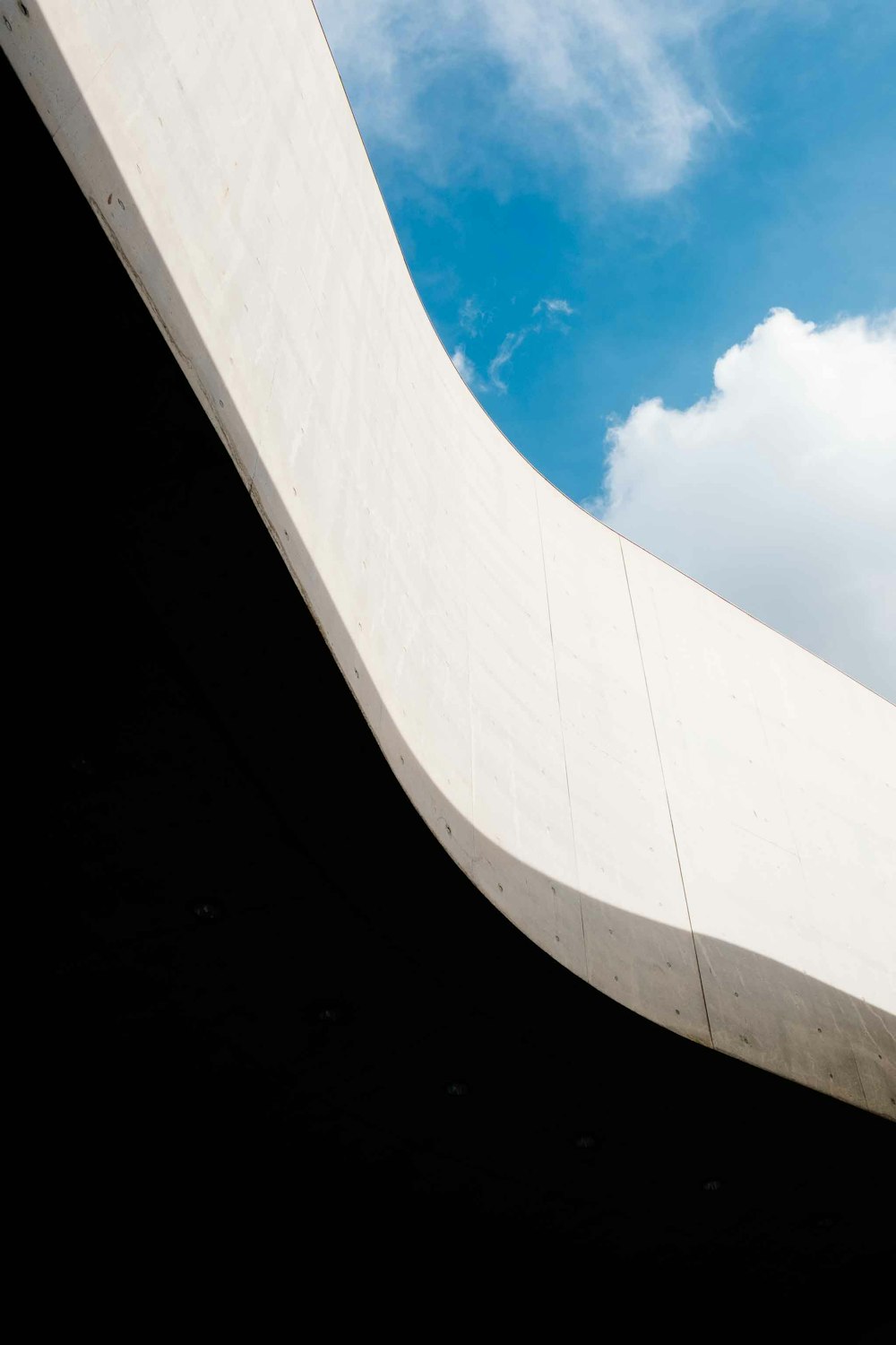 white concrete establishment under blue skies