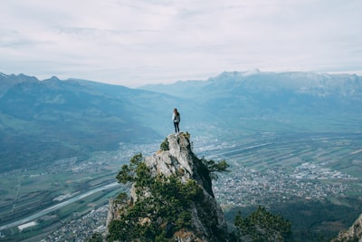 person standing on top of mountain liechtenstein zoom background