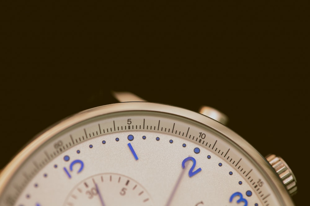 closeup photo of gray chronograph watch