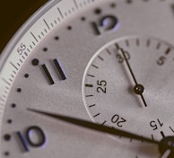 a close up of a silver watch face