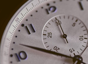 a close up of a silver watch face