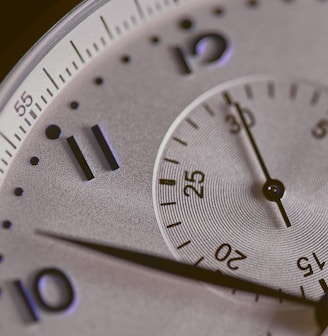 a close up of a silver watch face