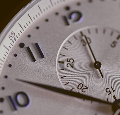 a close up of a silver watch face