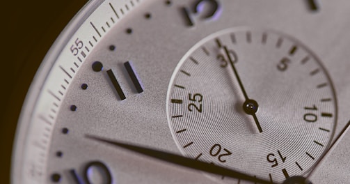 a close up of a silver watch face