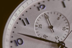 a close up of a silver watch face
