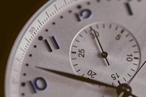 a close up of a silver watch face