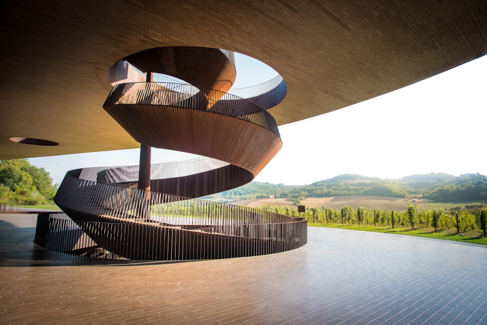 brown spiral staircase near mountains