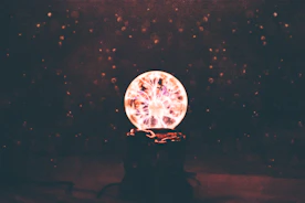 multicolored plasma ball in dim light room