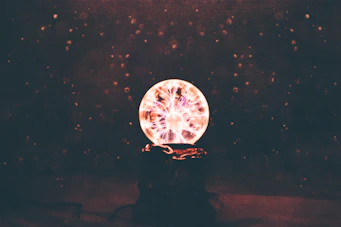 multicolored plasma ball in dim light room