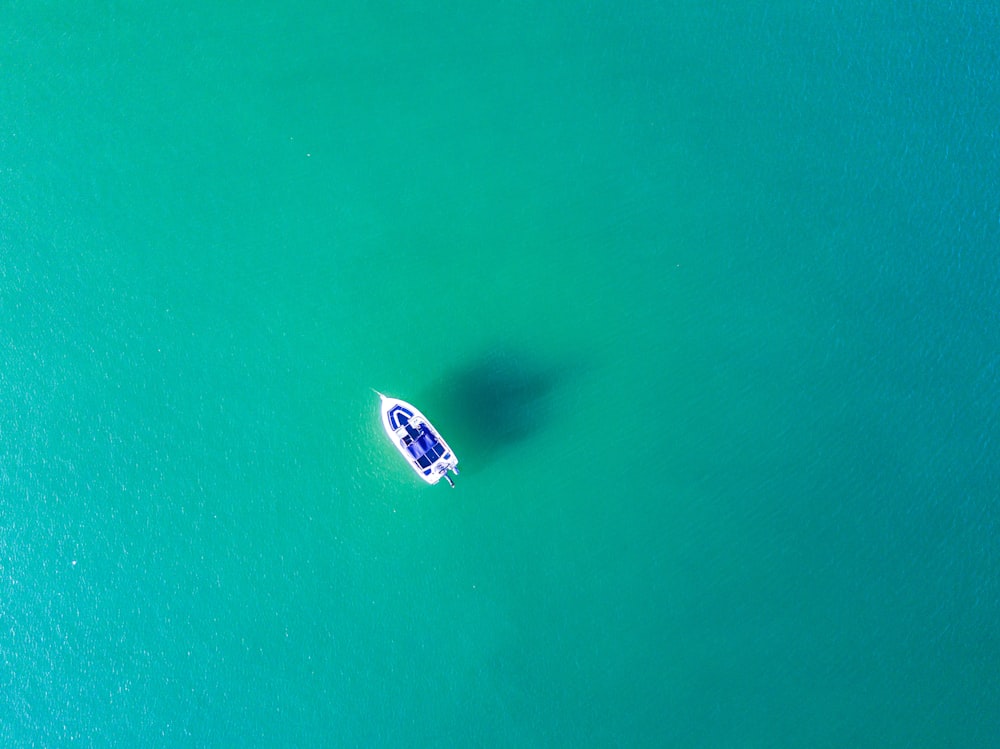 aerial photography of white sailing boat