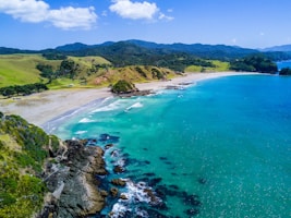 aerial view of beach with mountains