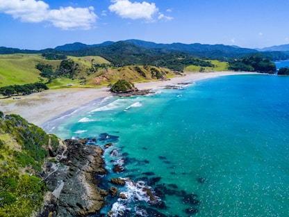 aerial view of beach with mountains