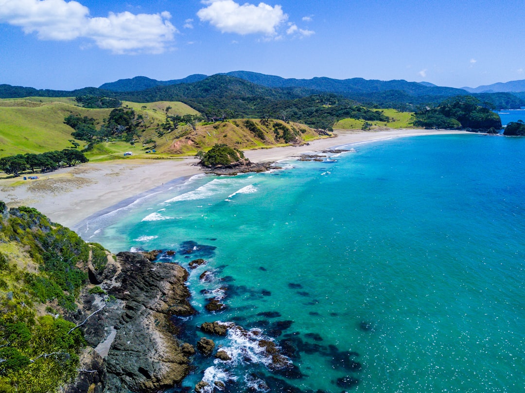aerial view of beach with mountains,