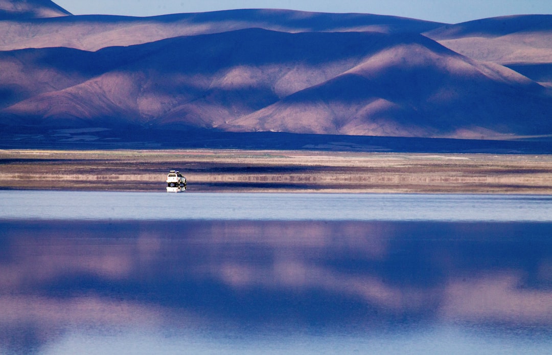 panoramic photography of mountain near body of water