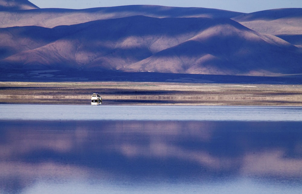 panoramic photography of mountain near body of water