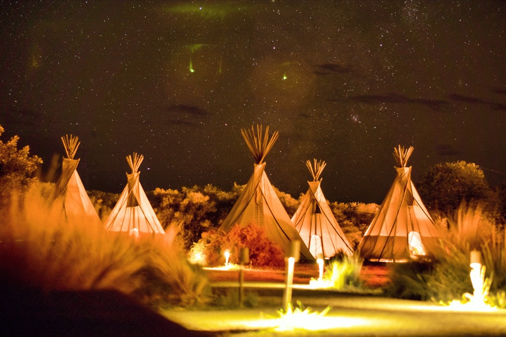 photography of tipi tents