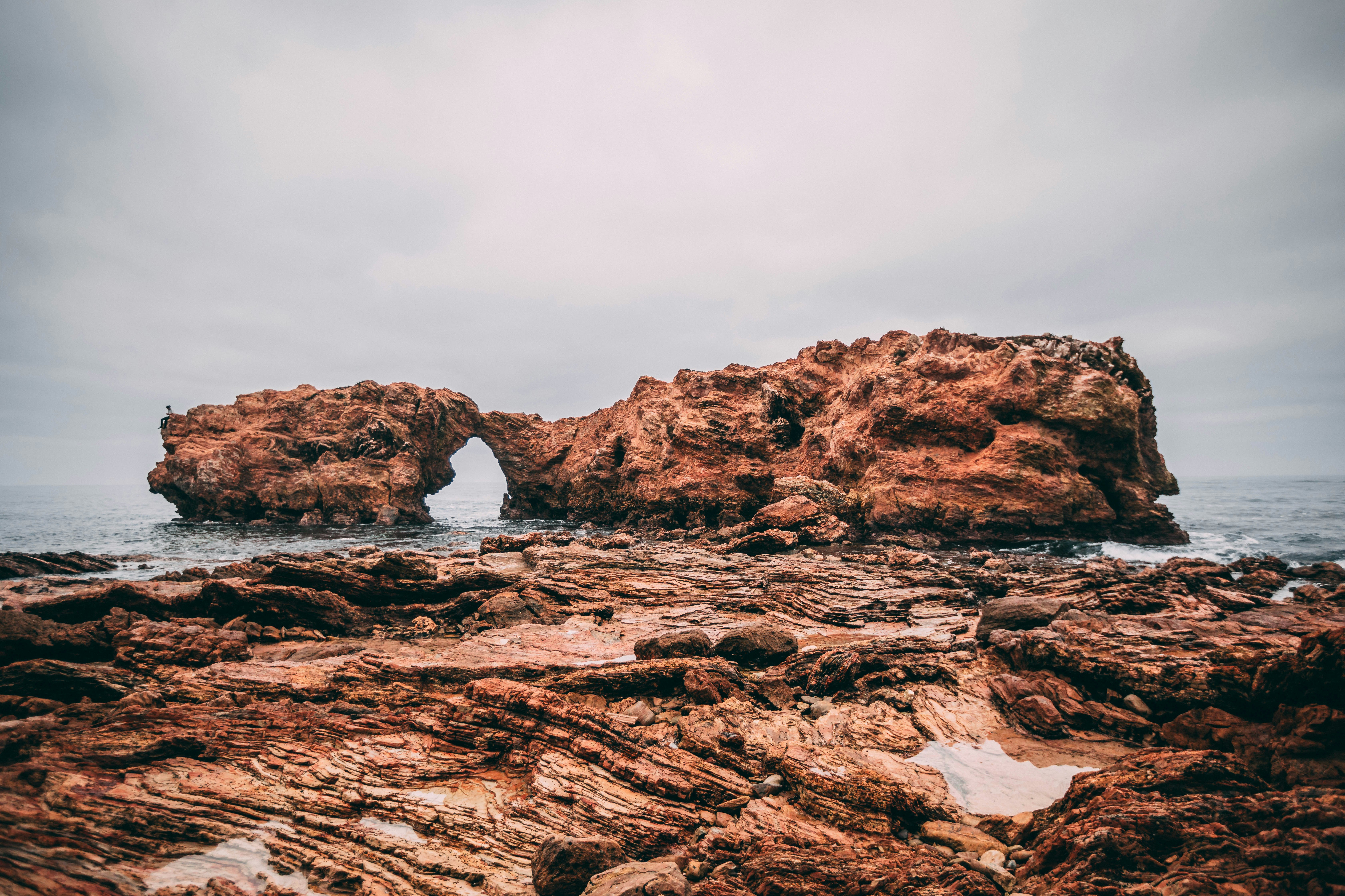 rock formation on body of water