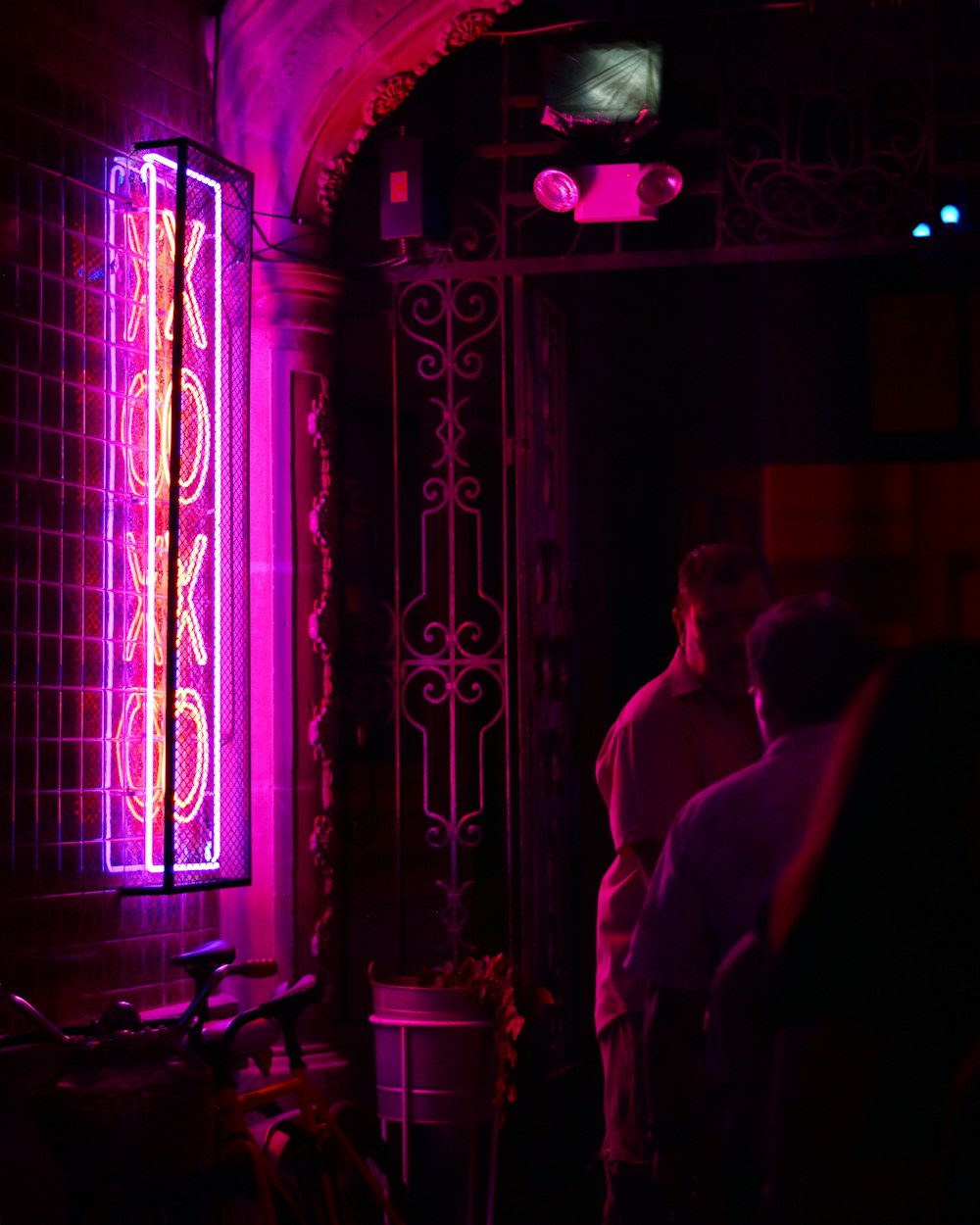 man standing on neon light