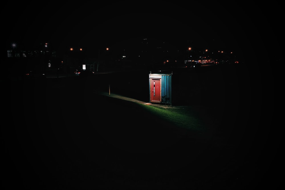 red door shed taken during night time