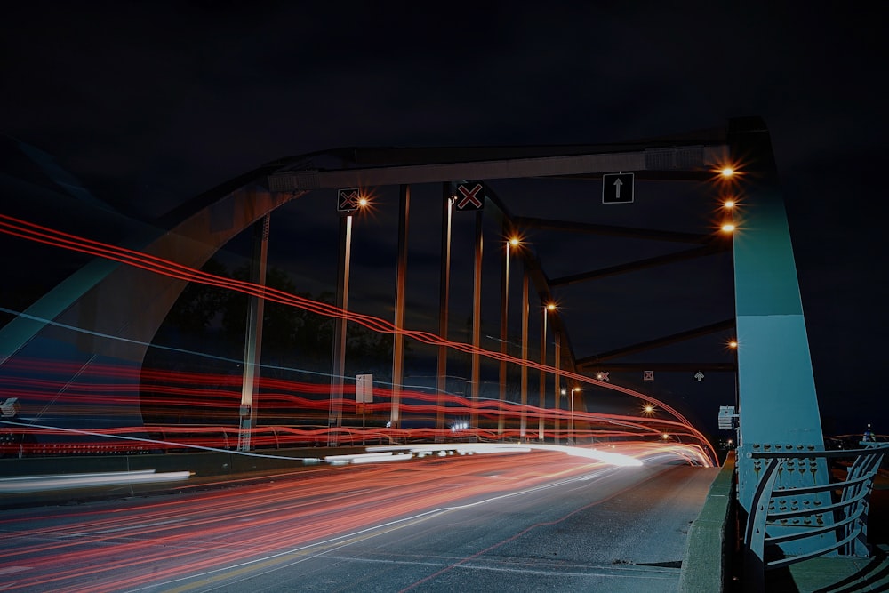 time lapse photography of road with arch