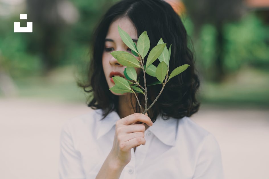 Woman in yellow tank top holding green leaves photo – Free Leaf Image on  Unsplash