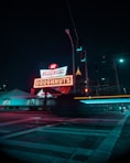 turned on Krispy Kreme Doughnuts neon signage