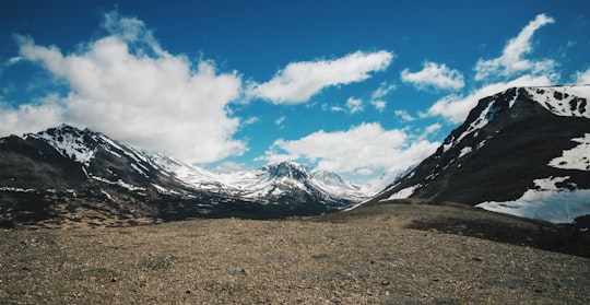 snow covered mountain under white clouds during daytime in Alaska United States