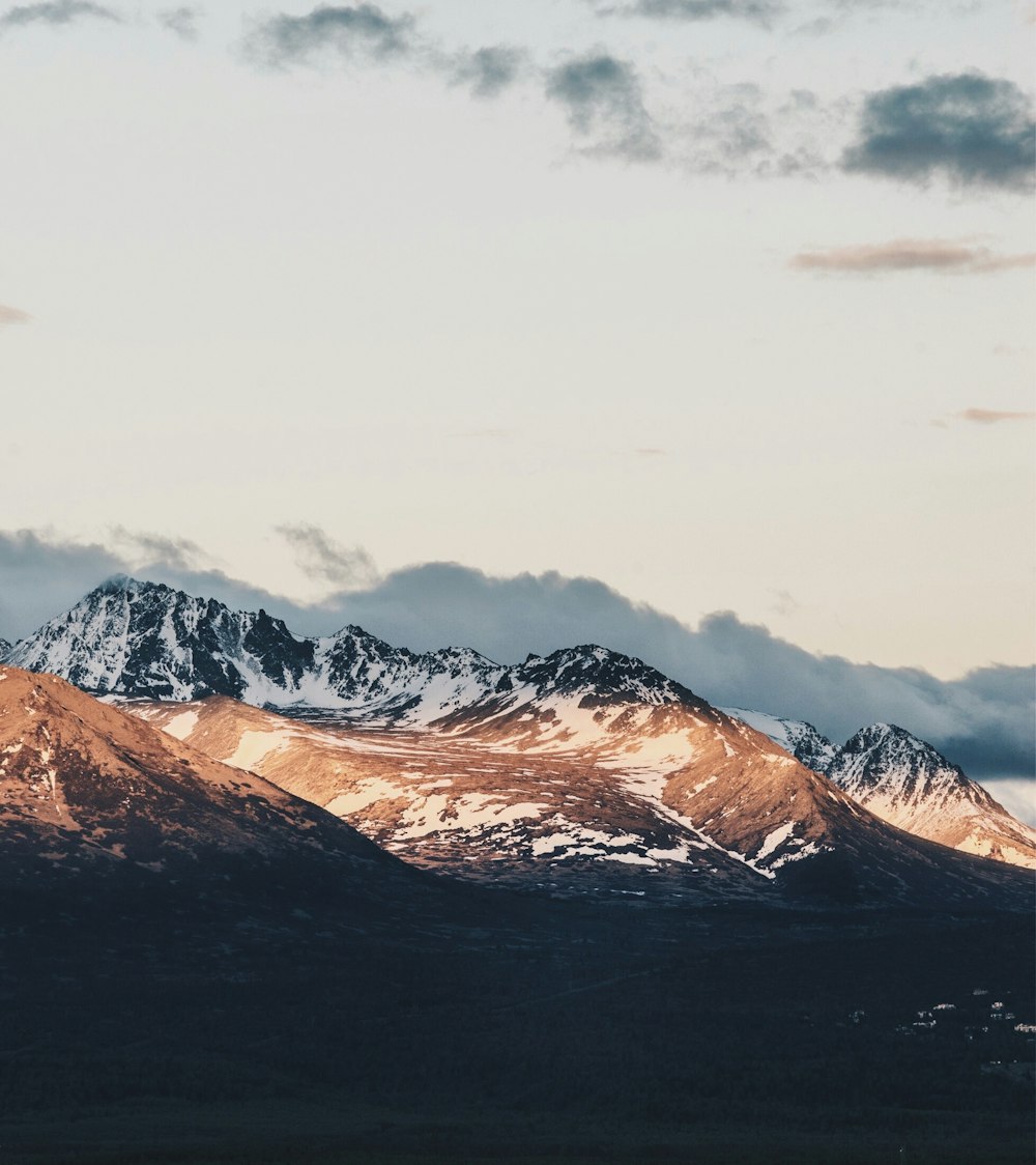 glacier mountain under gray sky at daytime