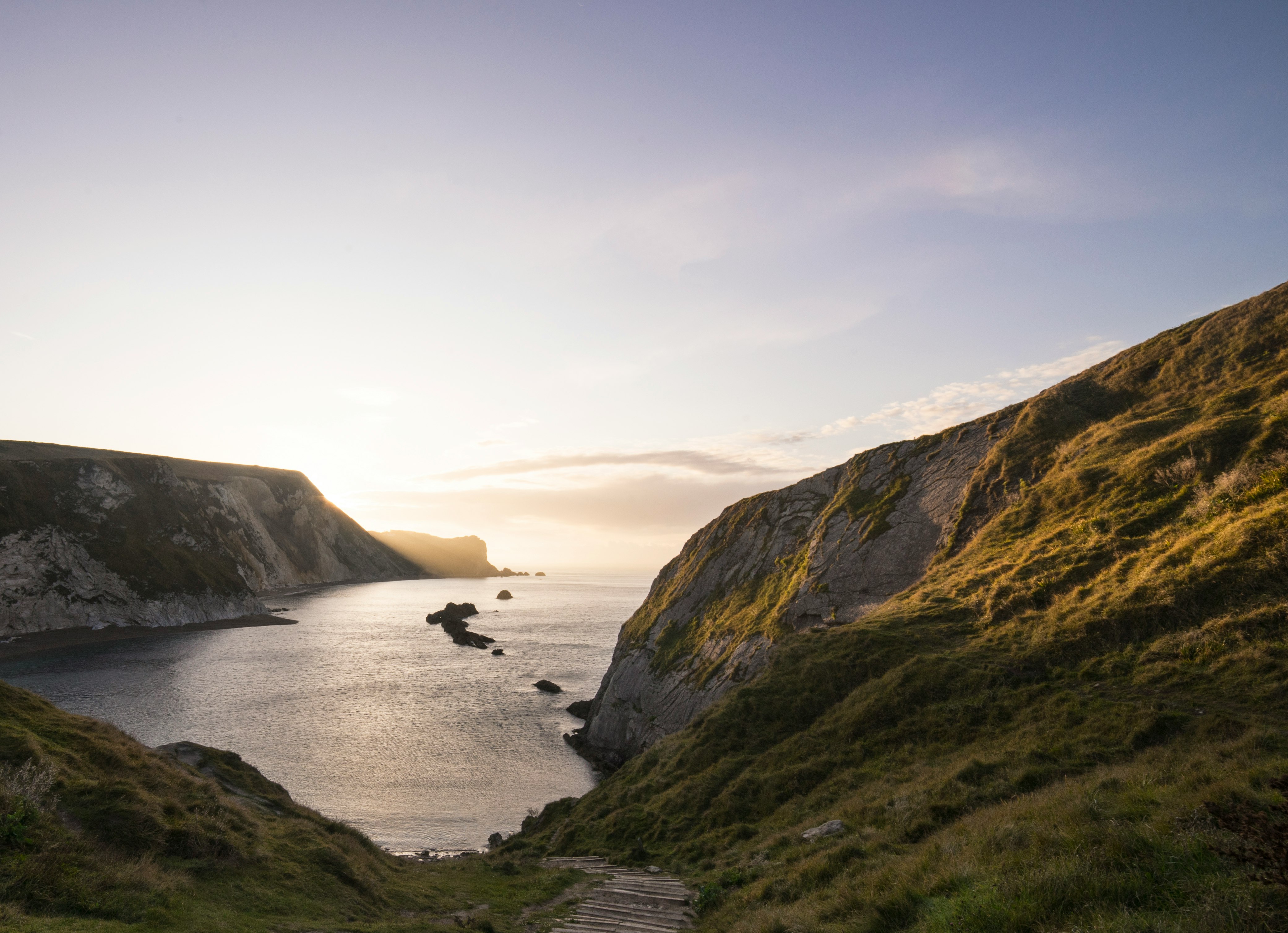landscape photography of cliff near body of water