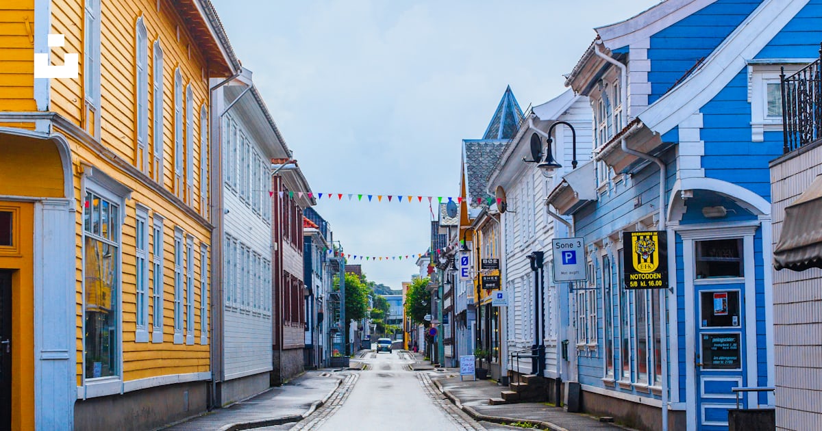 Empty road between houses with buntings photo – Free Street Image on ...