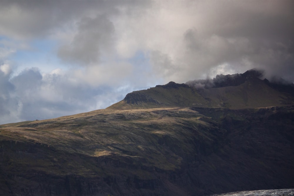 mountain under gray clouds