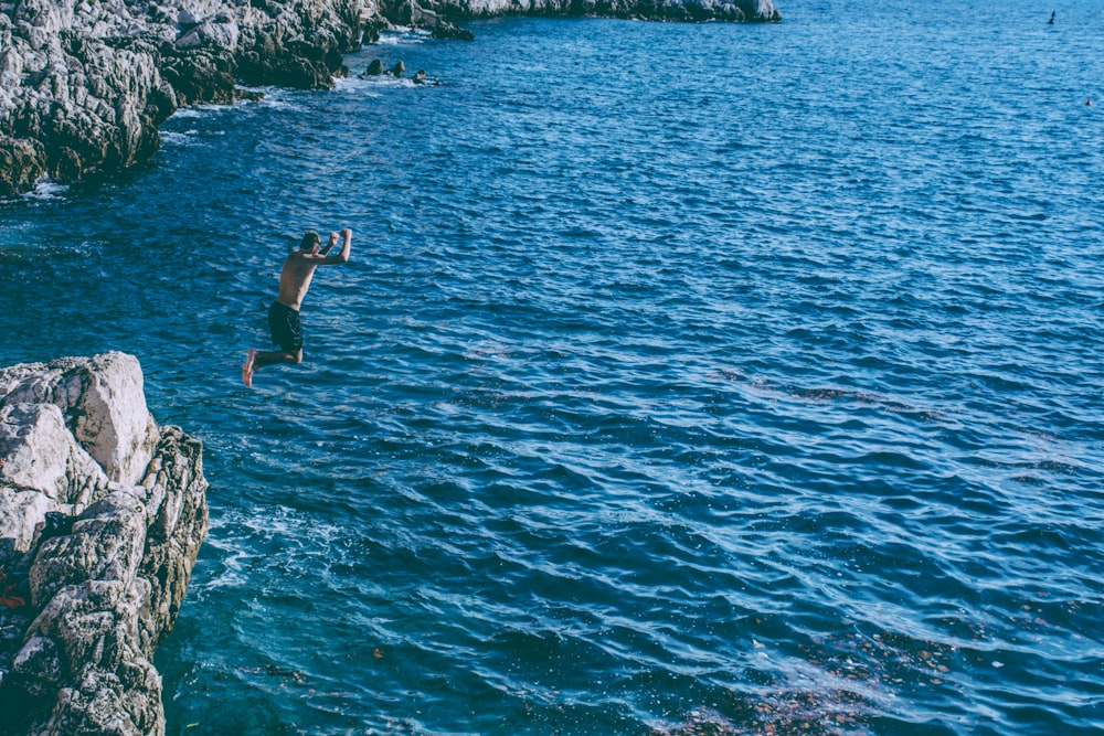 person jumped from rock cliff