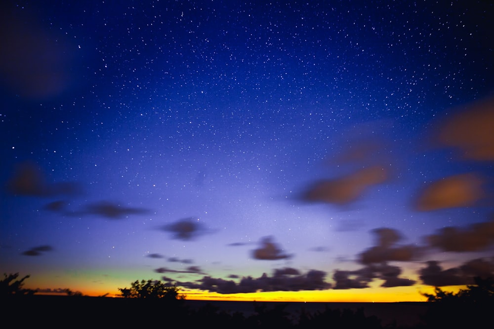 blue night sky with stars above plain