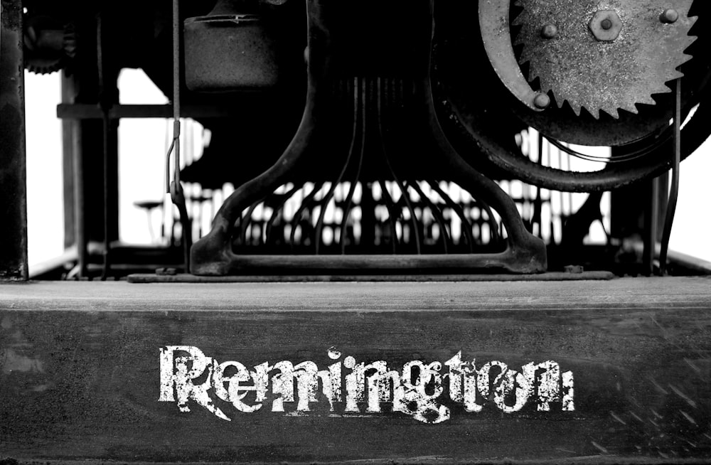 greyscale photography of Remington table machine