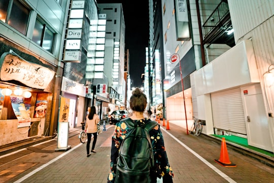 photo of person carrying black bag in Ginza Japan