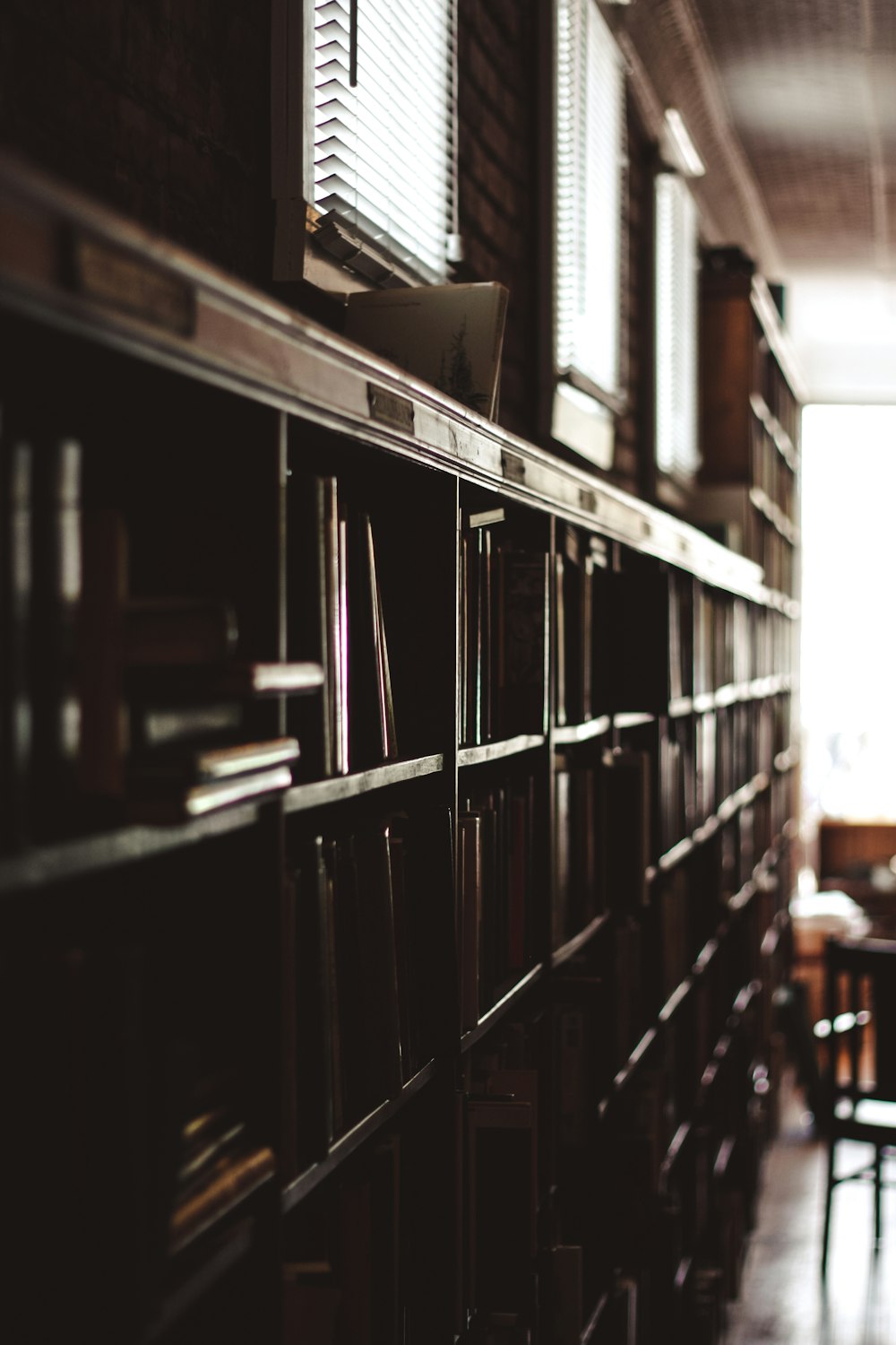 photo of brown wooden bookcase in room