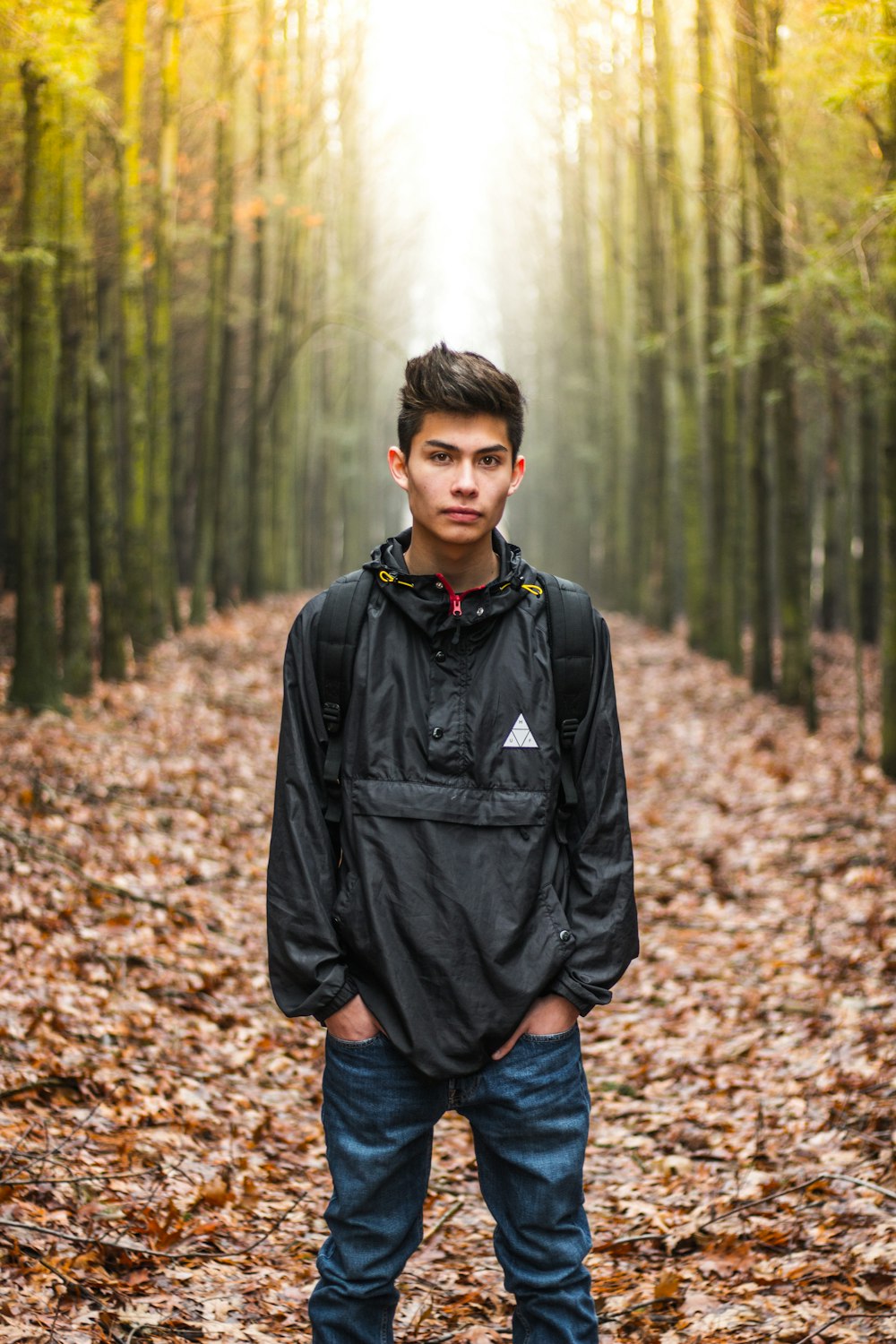 man wearing black quarter-zip windbreaker