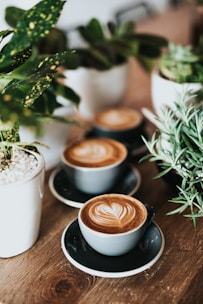 shallow focus photography of coffee late in mug on table