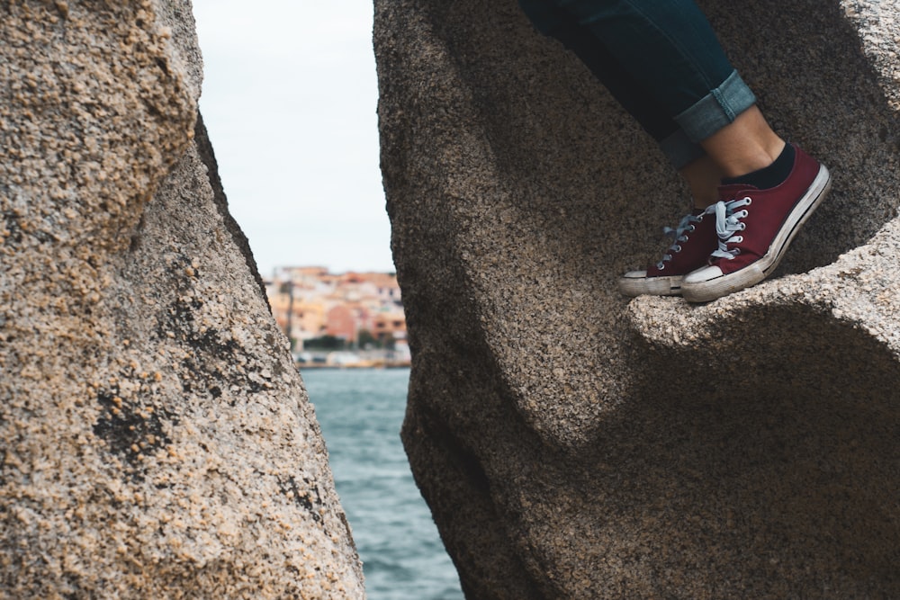 person climbing rocks