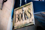 book signage hanging beside white wall