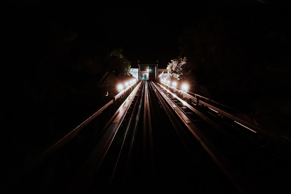 train track with light at night time
