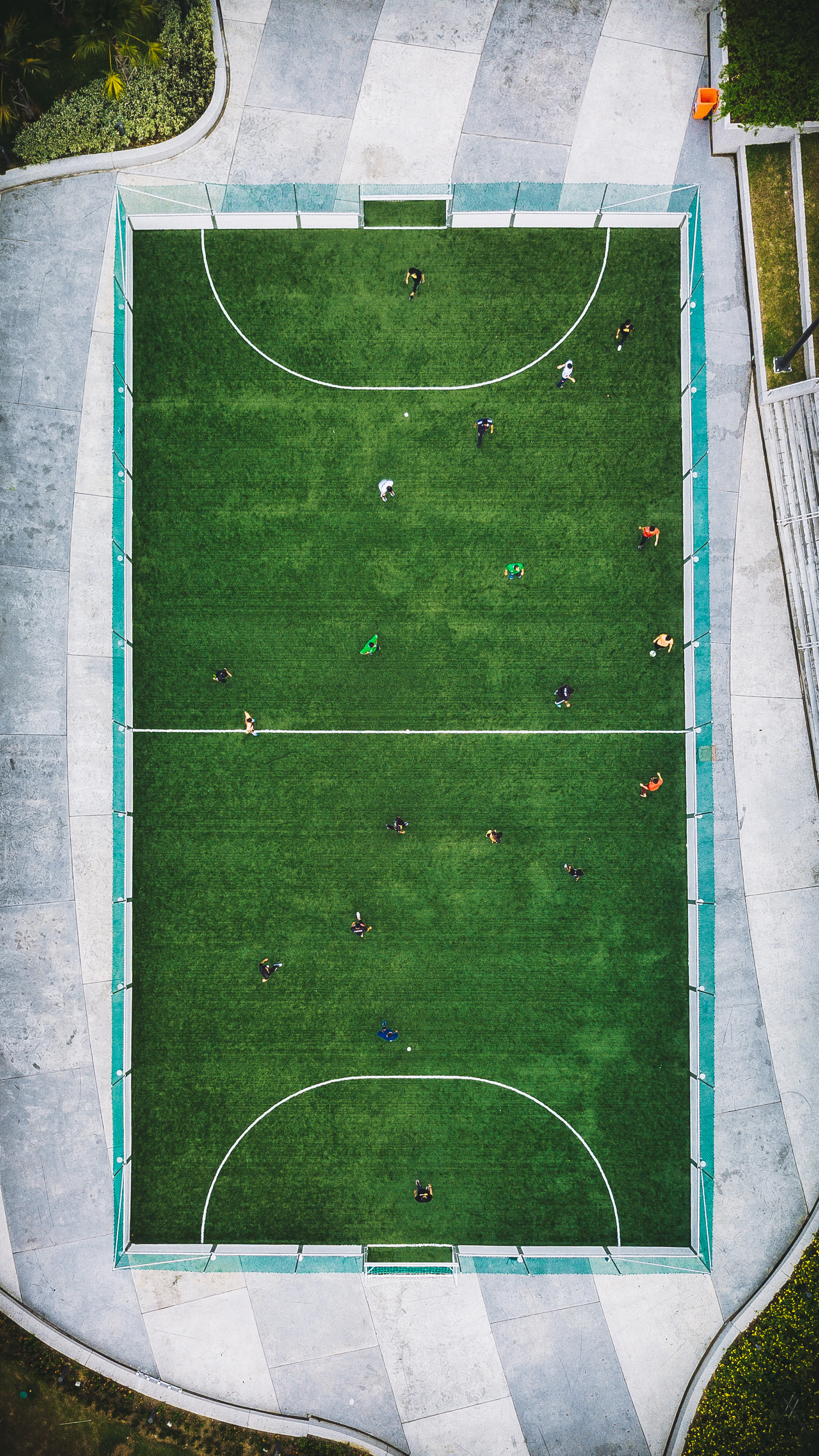Aerial view of players on a professional, well-marked sports court
