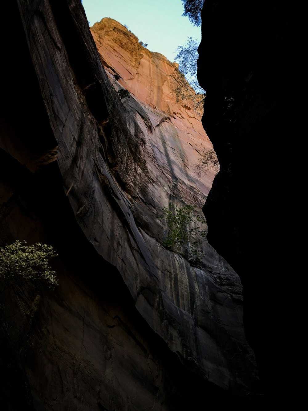 mountain face under blue sky during daytime